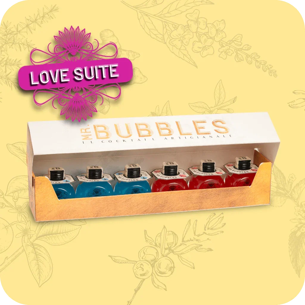 Confezione Mr. Bubbles Love Suite con sei mini cocktail artigianali colorati, sfondo giallo decorato